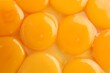 © New Africa - Fresh egg yolks as background, top view