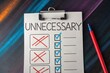 © Bee - Eliminating Unnecessary: A checklist with the word unnecessary on top, crossed off items and some checked items, along with a pen. An idea of organization or prioritization.