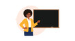 © Mst - Illustration of a black female teacher with an afro standing next to a blackboard pointing with a stick.