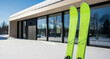© Irina Kado - Bright modern skis beside a snow-covered cabin winter sports scene — ideal for ski resort, mountain holiday, and winter activity concepts