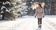© Irina Kado - Woman walking snowy trail winter travel lifestyle — cold weather and outdoor adventure concept
