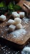 © COK House - Sugar chunks on a wooden board sprinkled with granulated sugar. Useful for articles on nutrition, cookery, healthy living and dessert recipes.
