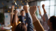 © Kateryna - Smiling business team celebrating success in office fists up confetti backs to camera or heads cropped team achievement faceless no visible faces celebration with copy