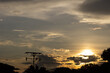 © ric - Silhouette of electric pole and sunset sky in the evening.