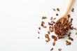 © New Africa - Delicious granola with chocolate chips in spoon on white background, top view. Space for text