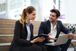 © DG PhotoStock - Businessperson discussing data and insurance sales in city.