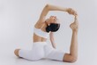 © anatoliycherkas - Full length image of sporty young woman with slim body doing yoga practice isolated on white background - concept of healthy life and natural balance between body and mental development
