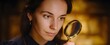 © ckybe - The woman uses a magnifying glass like a detective hunting tiny secrets.