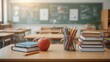 © Asawin - a bright classroom scene with school supplies on the desks. An apple sits prominently on the desk along with the pencils, books and notebook