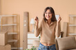 © Pixel-Shot - Happy young woman with keys to rented apartment in room on moving day