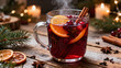 © Tatyana - Hot mulled wine with cinnamon and orange slices on wooden table