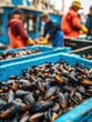 © Johannes - sustainable seafood concept fresh mussels piled in a blue crate at a seafood market with fishermen in the background showcasing vibrant marine life