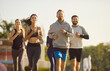 © Studio Romantic - Sporty group of happy friends, people running together outdoors, moving participating in fitness activity, health breathing in fresh air, dynamic exercise, active healthy lifestyle positive teamwork
