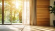 © cha - Bright sunny room with glass doors open to green foliage