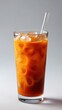 © paisorn - Refreshing Orange Beverage with Ice and Straw in Clear Glass