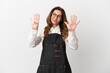 © luismolinero - Restaurant middle aged waiter woman isolated on white background counting nine with fingers