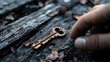 © Tara - Antique Key on Weathered Wood with Approaching Hand, Moody Lighting