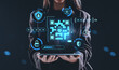 © ImageFlow - Businesswoman holding tablet with digital QR code and cybersecur