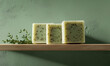 © Jae - Handcrafted herbal soap display on wooden shelf green background product photography minimalist close-up natural ingredients