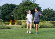 © Photographielove - Happy Senior Couple Jumping with Joy in Park, Embracing Active Healthy Lifestyle Together