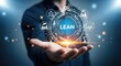 © Assetian - A man holding a digital display of the word lean and business icons