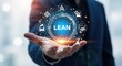 © Assetian - A man holding a digital display of the word lean and business icons