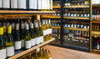 © Barillo_Images - Conceptual background of wine retail sector with wine bottles on display in liquor store.