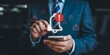 © Adobe worker  - Person in suit touching smartphone displaying alert notification bell and warning icons Futuristic Technology Background Design