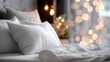 © Fauzi - Cozy bedroom with plush pillows and soft, warm bokeh lights