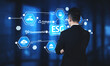 © InfiniteFlow - A business professional stands in front of a digital display showcasing ESG elements, emphasizing the importance of sustainability and responsible governance in modern enterprises. Tessel