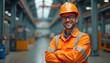 © Maryna - Happy worker in orange safety gear poses at an industrial facility. Man wearing hard hat and reflective vest smiles confidently. Industrial worker with crossed arms is ready for work in a factory.