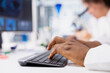 © DC Studio - Closeup of research facility professional using PC software to evaluate genetic marker associated with disease risk. Worker types on keyboard, studies DNA strand mapping with genomics analysis program