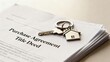 © Tonton1541 - first time homebuyer loan house concept. Documents with house keys on a purchase agreement and title deed.