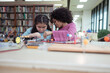 © Wosunan - A kid students in a robotics project during a STEM class in the library