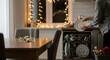 © Elenba - Loading dishwasher after christmas dinner, woman loads dirty plates into dishwasher, preparing for new year celebration. After christmas cleanup involves tidying dishes after family meal,