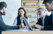© opolja - Successful business professionals presenting analytical report, working together in corporate office