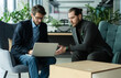© opolja - Businessmen discussing deal, sharing startup ideas, business partners negotiations or job interview in modern office