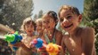 © ปฏิภาน ผดุงรัตน์ - Children splashing and spraying each other with water guns on a sunny day. Their faces are beaming with joy and excitement