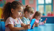 © Vadym - Children focus on tablets in preschool classroom learning. Young kids use mobile devices for education, developing skills. Preschoolers gain knowledge via tech interaction in class.