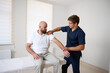 © Василь Івасюк - Chiropractor adjusting male patient’s shoulder in clinic. Physiotherapist performing manual therapy to relieve pain, improve mobility, support rehabilitation after injury or musculoskeletal disorder.