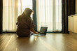 © shine - Enjoying sunny day, Middle aged woman typing on laptop keyboard, online working, surfing the internet, searching the information at home. Sunshine, Nature, Happiness, Summertime, Lifestyle, Leisure