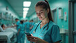 © Vadym - Young nurse uses phone in hospital hallway. Blurred patients and staff in background. Medical pro checks mobile device amidst hospital bustle. Healthcare worker busy on phone.