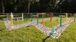 © Dino - Colorful obstacle course in a grassy park