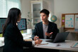 © PaeGAG - Businessmen discussing financial data during office meeting