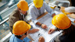 © Kateryna - Top view of faceless engineer and architect team meeting around construction blueprints measuring building layout planning session construction site coordination project discus