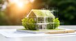 © ArtSync Studio - Sustainable Home Design Concept Green House Model with Construction Blueprint on White Paper