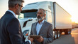 © Pete - Two businessmen review truck insurance policy documents. Agent discusses coverage options with owner. Commercial vehicle protection for cargo and fleet.