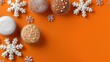 © OleksandrZastrozhnov - Festive cupcakes and snowflakes on a vibrant orange background for holiday season
