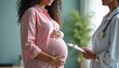 © Pete - Woman with doctor during pregnancy exam. Expectant mother holds tummy with hands. Health pro checks baby heart beat. Girl gets consultation in clinic for maternity questions.