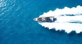 Speedboat cruising fast in clear blue ocean water day